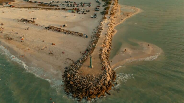 Aerial view of the jetty and clear water at St. Andrews State Park