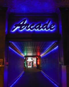 Neon-lit arcade entrance, indoor family fun attraction